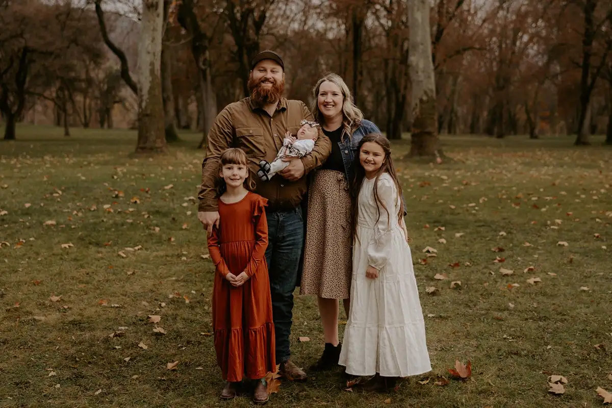 Dylan Thompson with wife and 3 daughters